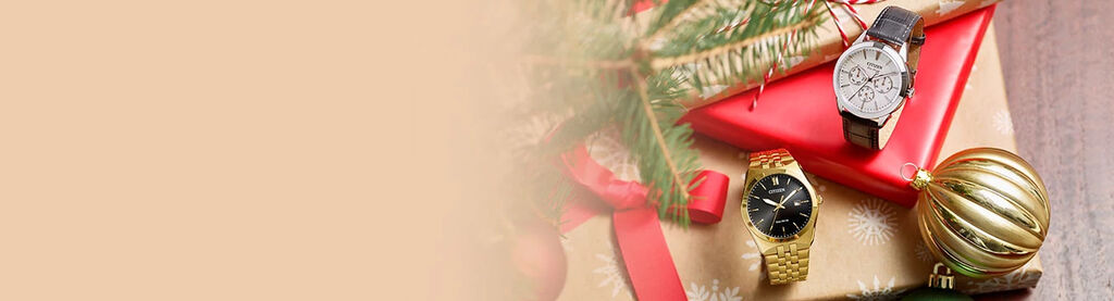 Image of gifts under holiday tree with Corso watch model BM7333-85E and Rolan watch model BU2110-01A