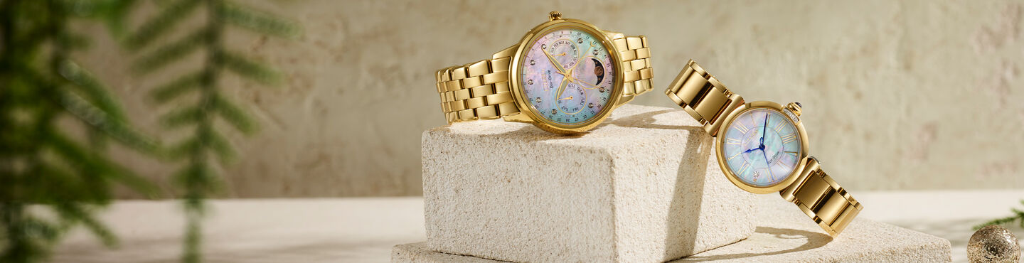 Women's Watches, featuring image of Calendrier watch model FD0002-57D and Citizen L Mae watch model EM1062-57D